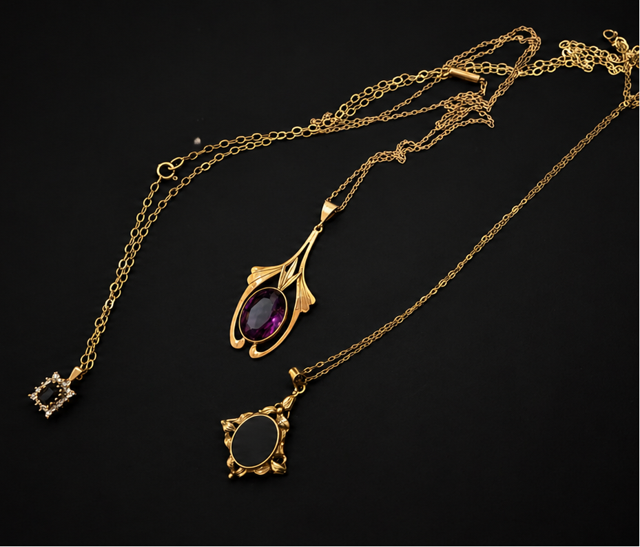 Gold necklace with a purple gemstone pendant on a black background