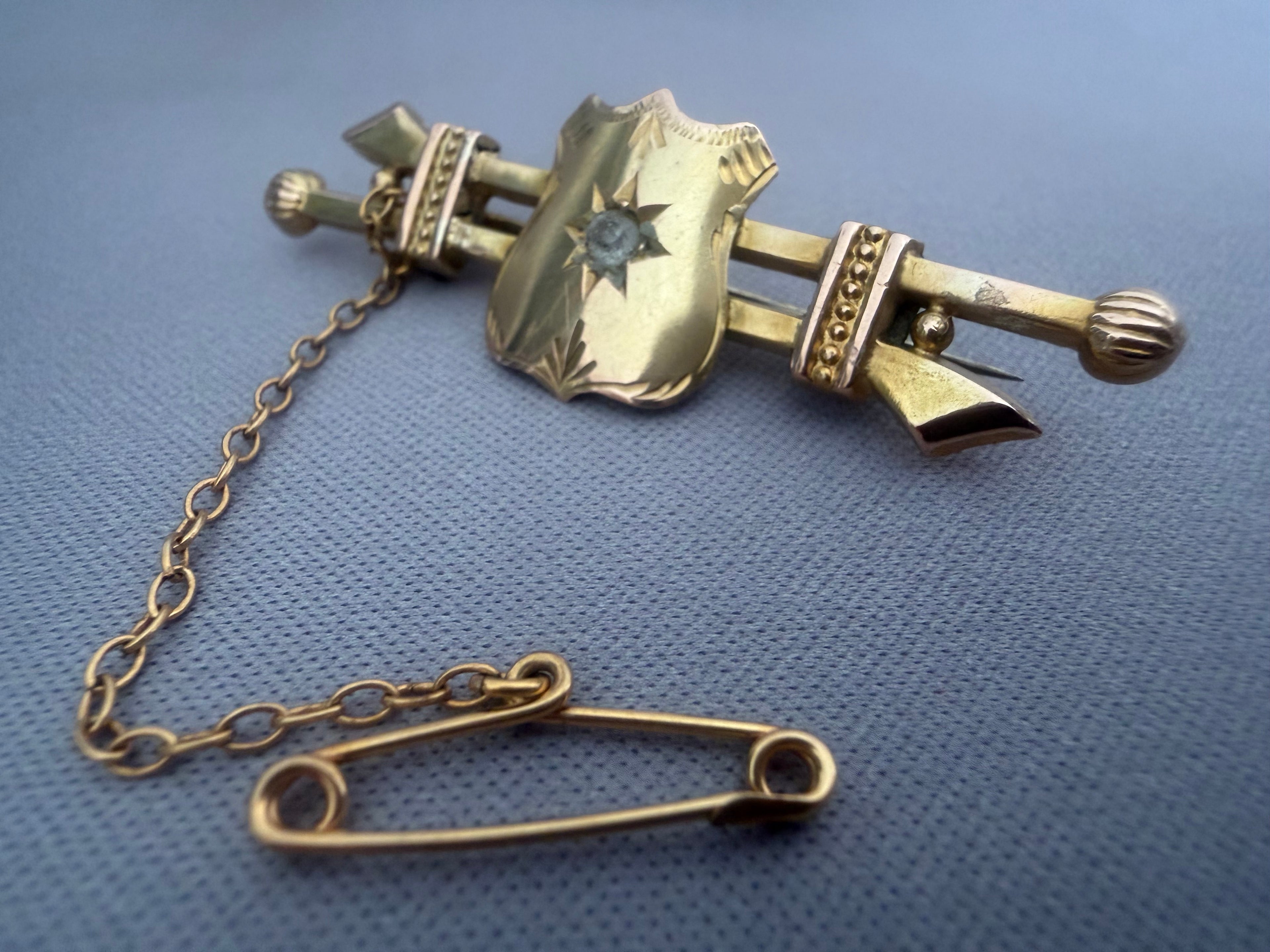 Antique Australian Gold brooch with shield design and chain.  Aronson & Co Melbourne