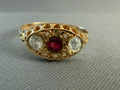 Antique Victorian 18ct gold paste ring, front — ruby-coloured centre with white paste accents, Birmingham 1905
background