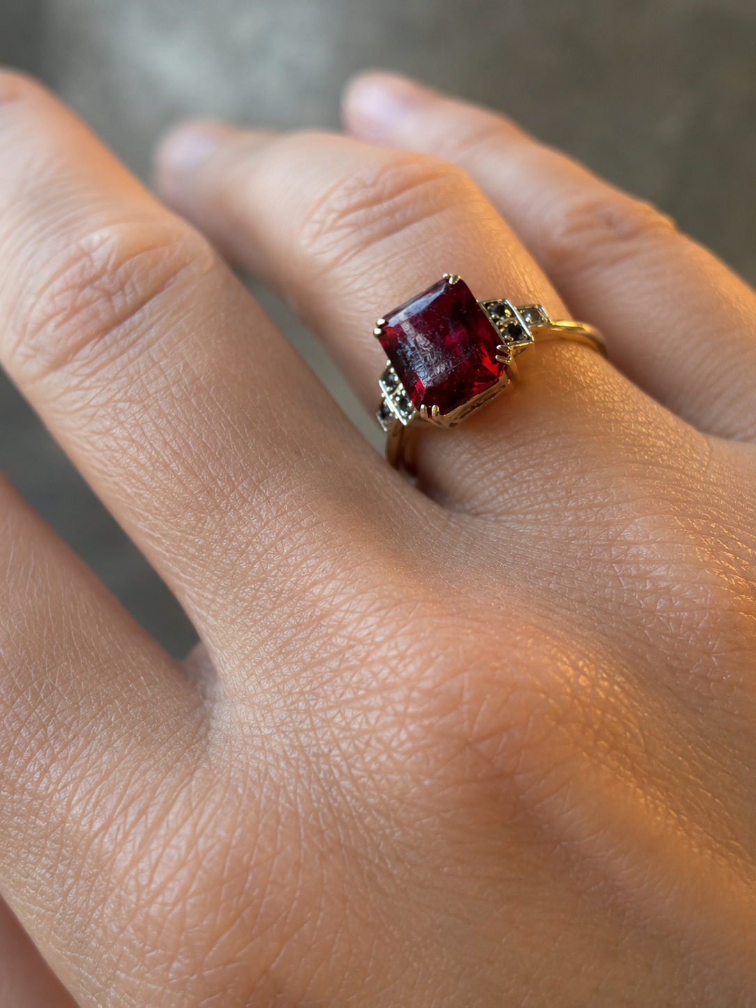 Antique crimson paste and diamond ring in 9ct gold, J. Lawrence, worn on hand