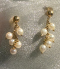 Vintage 9ct gold freshwater pearl cluster stud earrings, front view — 1970s