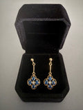Vintage 9ct gold drop earrings with blue oval sapphires in a clover quatrefoil design and central diamond accent